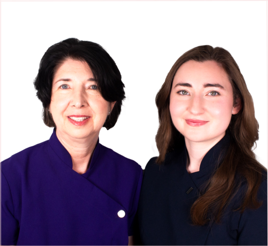 Leah and Amber from Chichester Electrolysis, wearing uniform and smiling together